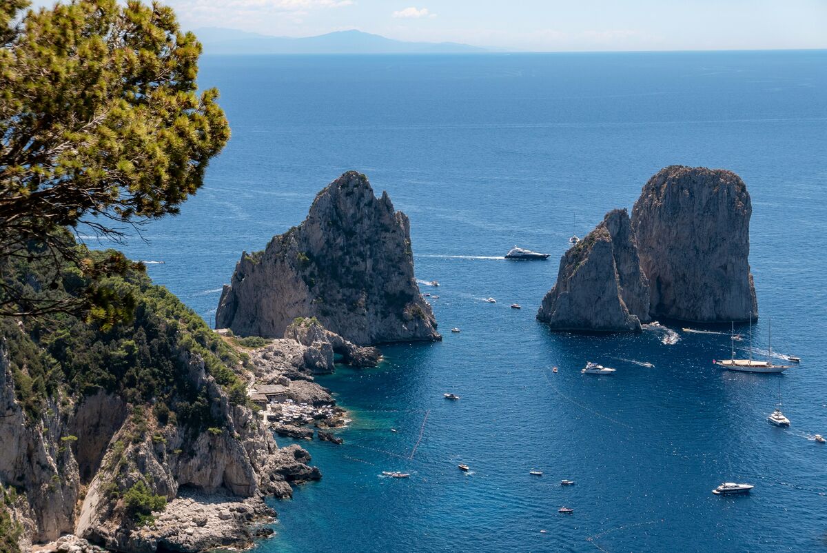 Rocky Capri coastline with the Faraglioni in the distance